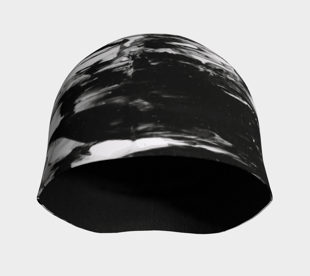 Interior view of a black and white abstract pattern beanie, showing the black bamboo lining.