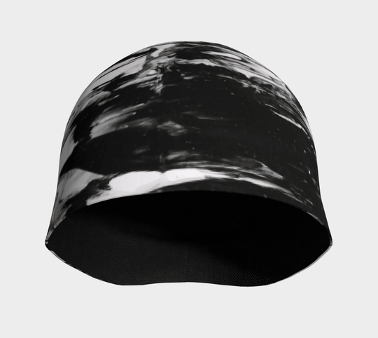 Interior view of a black and white abstract pattern beanie, showing the black bamboo lining.