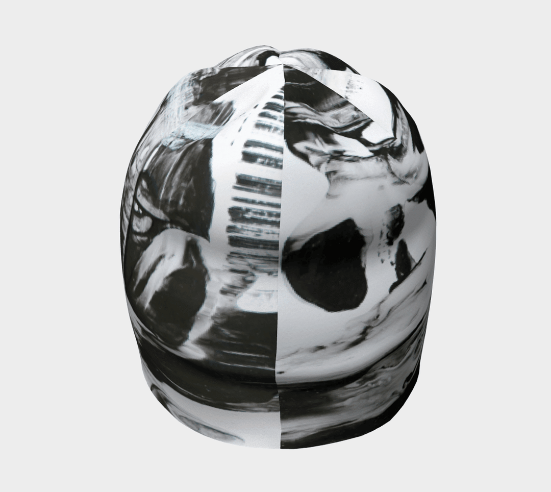Top view of a black and white abstract pattern beanie, showing the dynamic print.