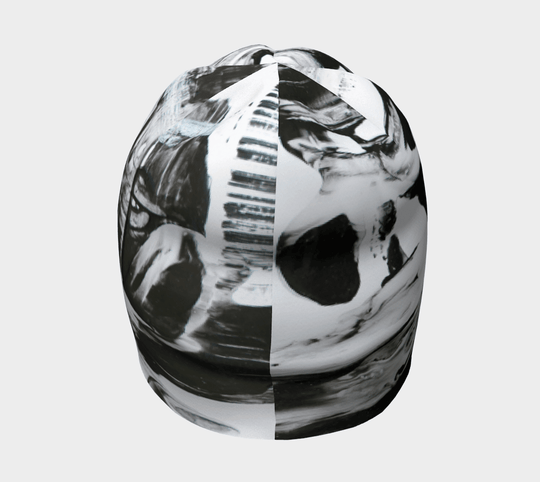 Top view of a black and white abstract pattern beanie, showing the dynamic print.