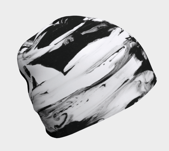 Close-up of a black and white abstract pattern beanie.