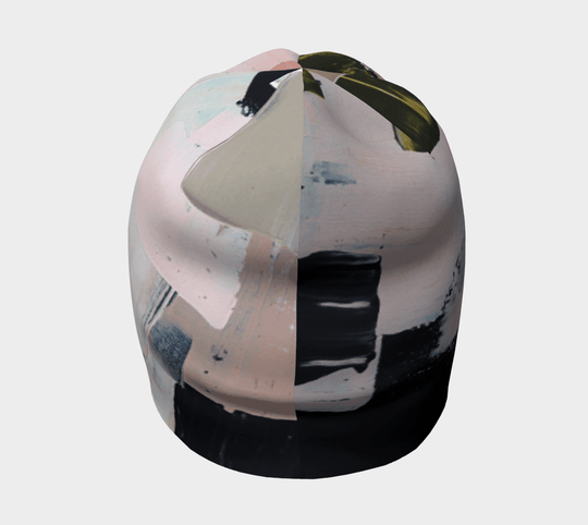 Top view of the modern quilt beanie revealing the abstract pattern with pink and dark grey sections.