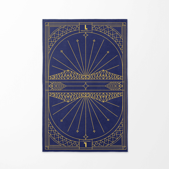 The geometric cityscape design of the Montreal towel, featuring a stylized bridge.