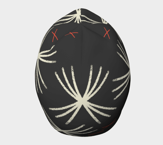 MotifX Black Beanie from a slightly elevated angle, displaying the unique white sunburst and red cross pattern.