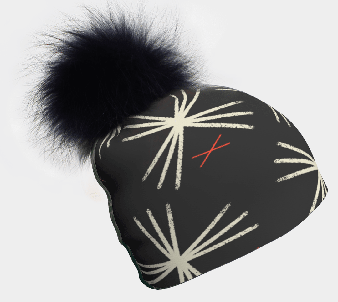 Black MotifX beanie with a large black pompom and a white graphic pattern.