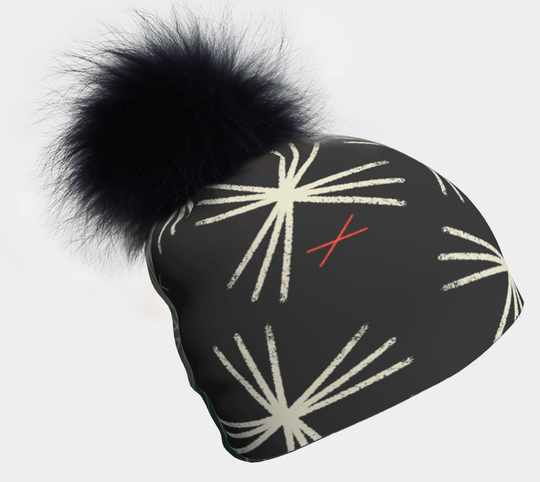 Black MotifX beanie with a large black pompom and a white graphic pattern.