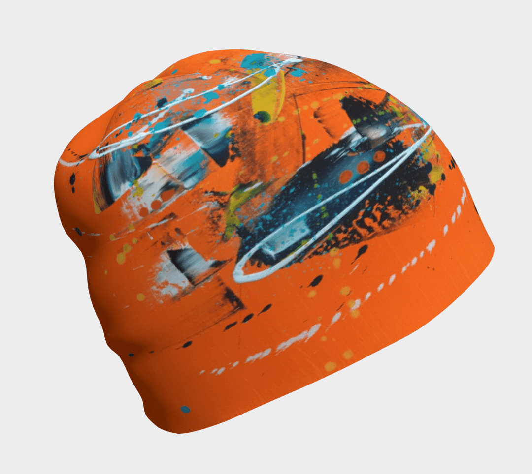 Orange beanie with abstract art pattern, shown flat against a white background.