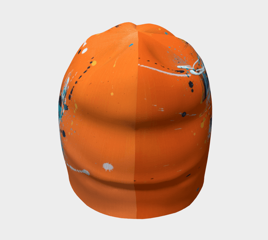 Front view of the orange abstract beanie, folded to show its compact size.