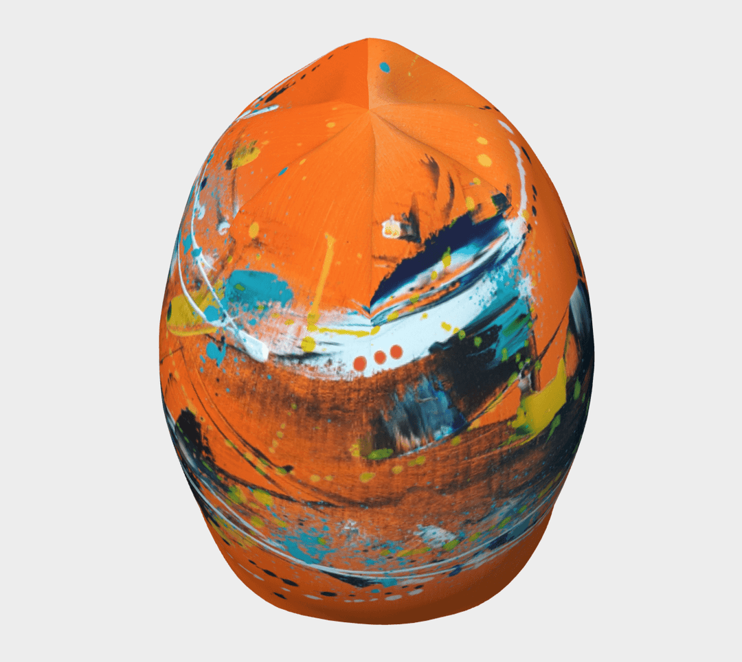 Rear view of the orange abstract beanie, emphasizing its rounded crown and art pattern.