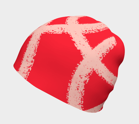 Red beanie with abstract peach-coloured swirl pattern, side view.