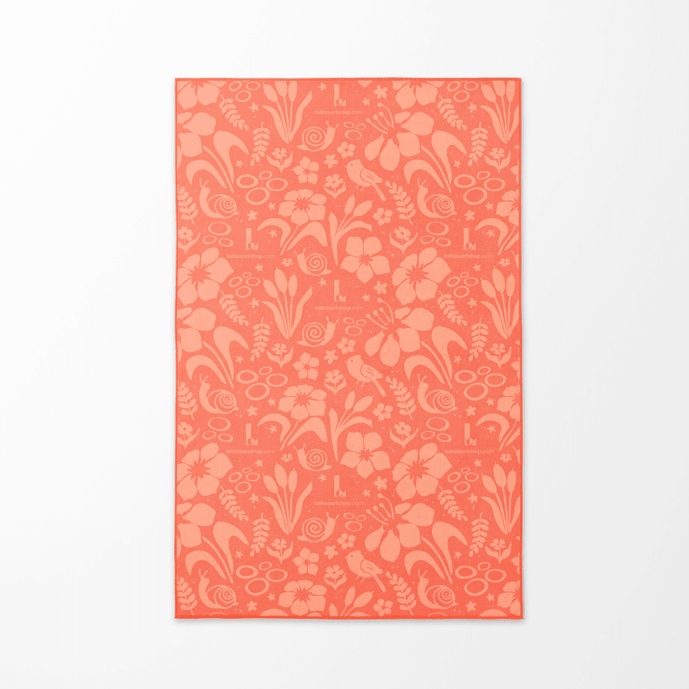 The coral floral pattern side of the Playful Rain kids&