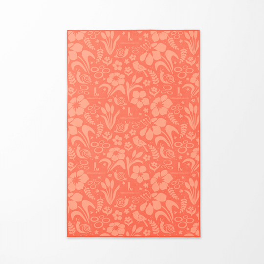 The coral floral pattern side of the Playful Rain kids&