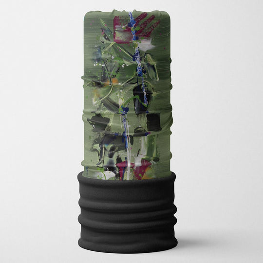 Abstract-art neck gaiter in olive green, black, and magenta displayed on a cylindrical stand with a black fleece base
