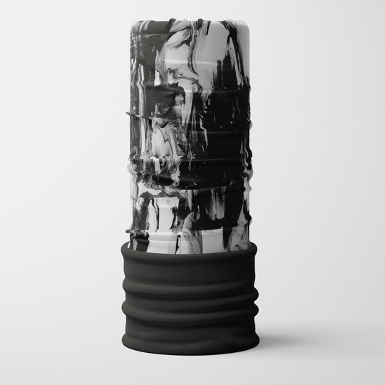 A tall, upright tube accessory with a black and white abstract marbling pattern and a black fleece bottom.