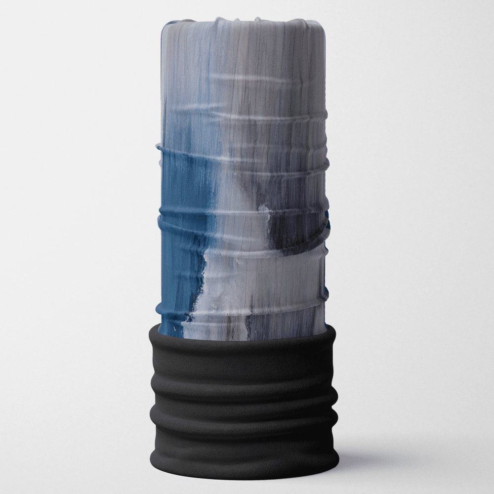 A cylindrical tube with a 'Golden Sea' artistic print in blue, grey, and white, featuring a black ribbed bottom, standing against a white background.