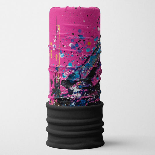 Pink, blue, and black abstract paint splatter design on a black-bottomed tube.