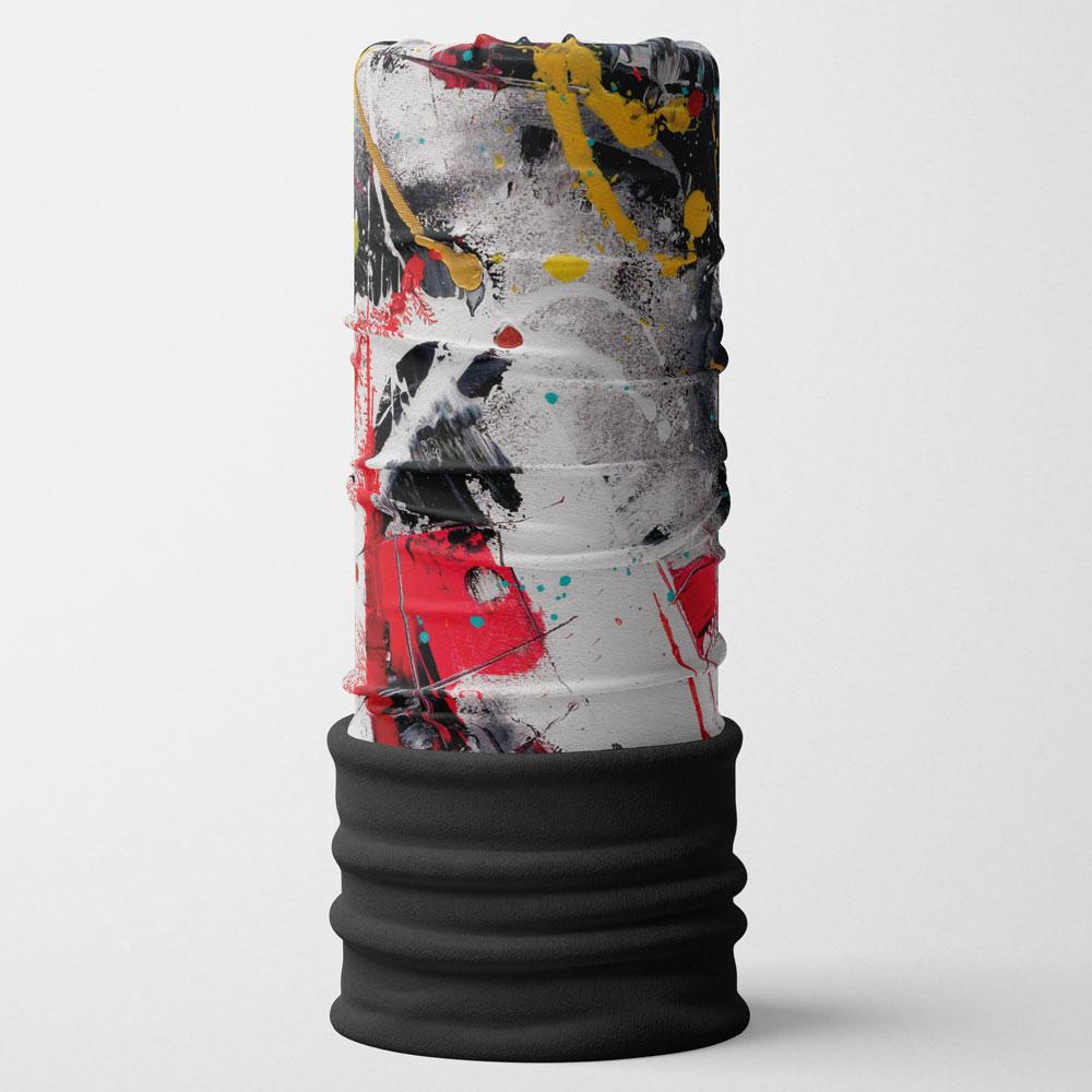 A standing tube with a vibrant red, black, yellow, and white abstract art pattern, topped with a black ribbed cuff.