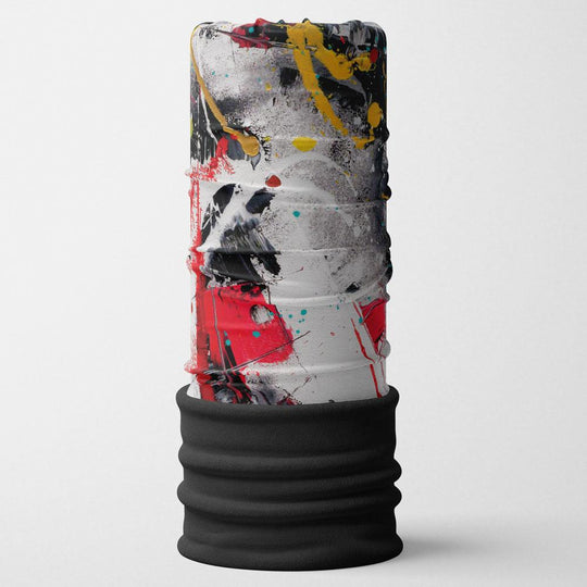 A standing tube with a vibrant red, black, yellow, and white abstract art pattern, topped with a black ribbed cuff.