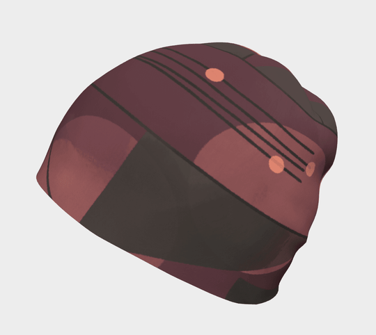 Side view of the Purple Geometrics Beanie with a plum, grey, and peach abstract design.
