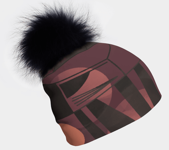 Purple Geometrics Beanie with a fluffy black pompom against a white background.