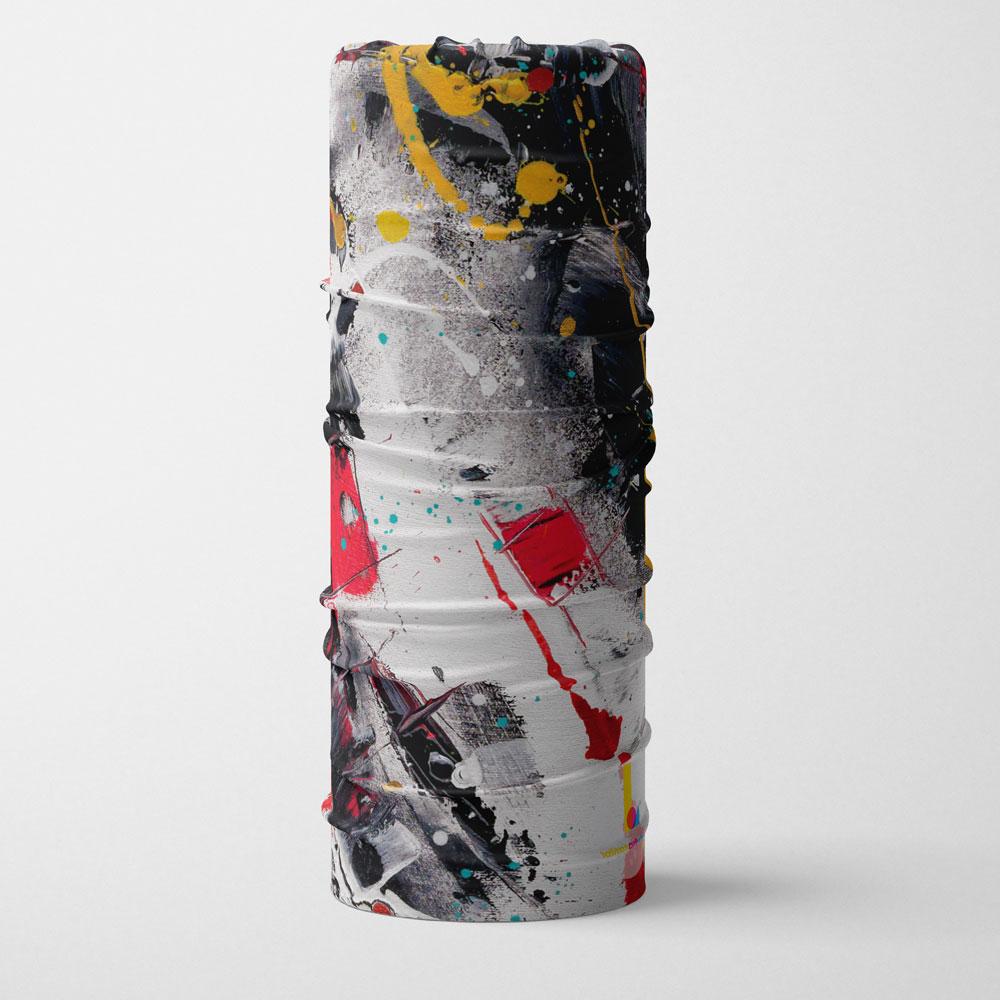A multifunctional tube with abstract red, white, yellow, and black paint splatter pattern, rolled and standing.