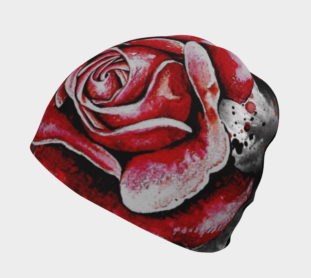 A close-up view of the Red Rose Beanie showcasing the intricate red and white rose design against a black background.