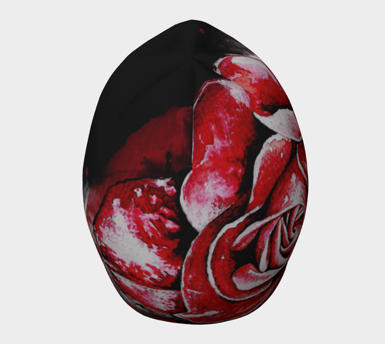 A dynamic angle of the Red Rose Beanie, focusing on the vibrant red rose artwork and its detailed petals.