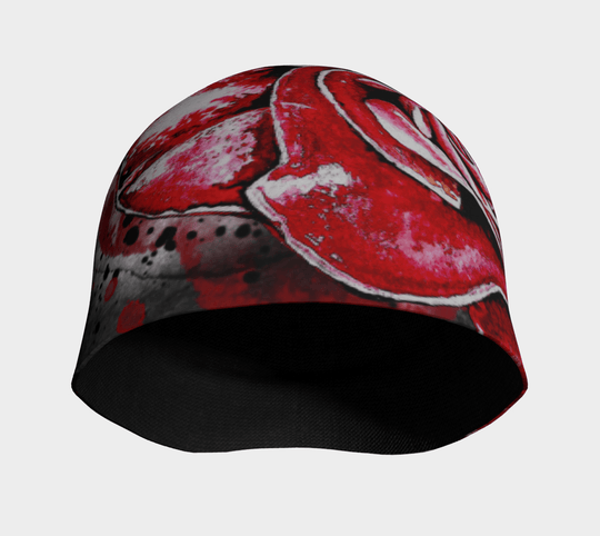 The Red Rose Beanie is shown from the front, revealing the full floral design and its soft, rounded top.