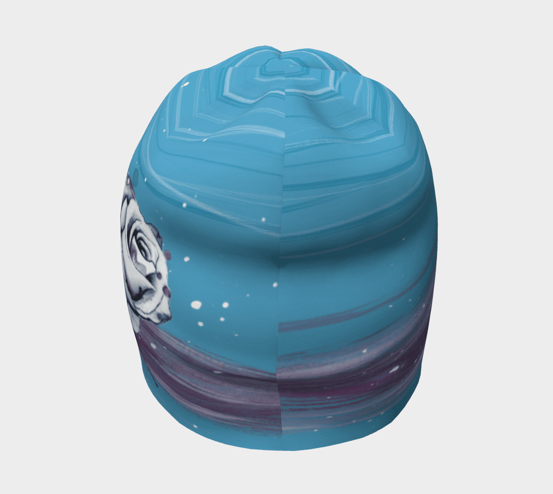Top view of a blue beanie featuring a watercolor floral design with painted brush strokes.