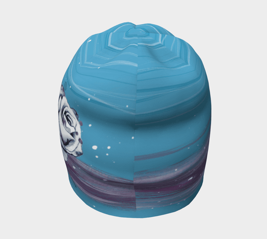 Top view of a blue beanie featuring a watercolor floral design with painted brush strokes.