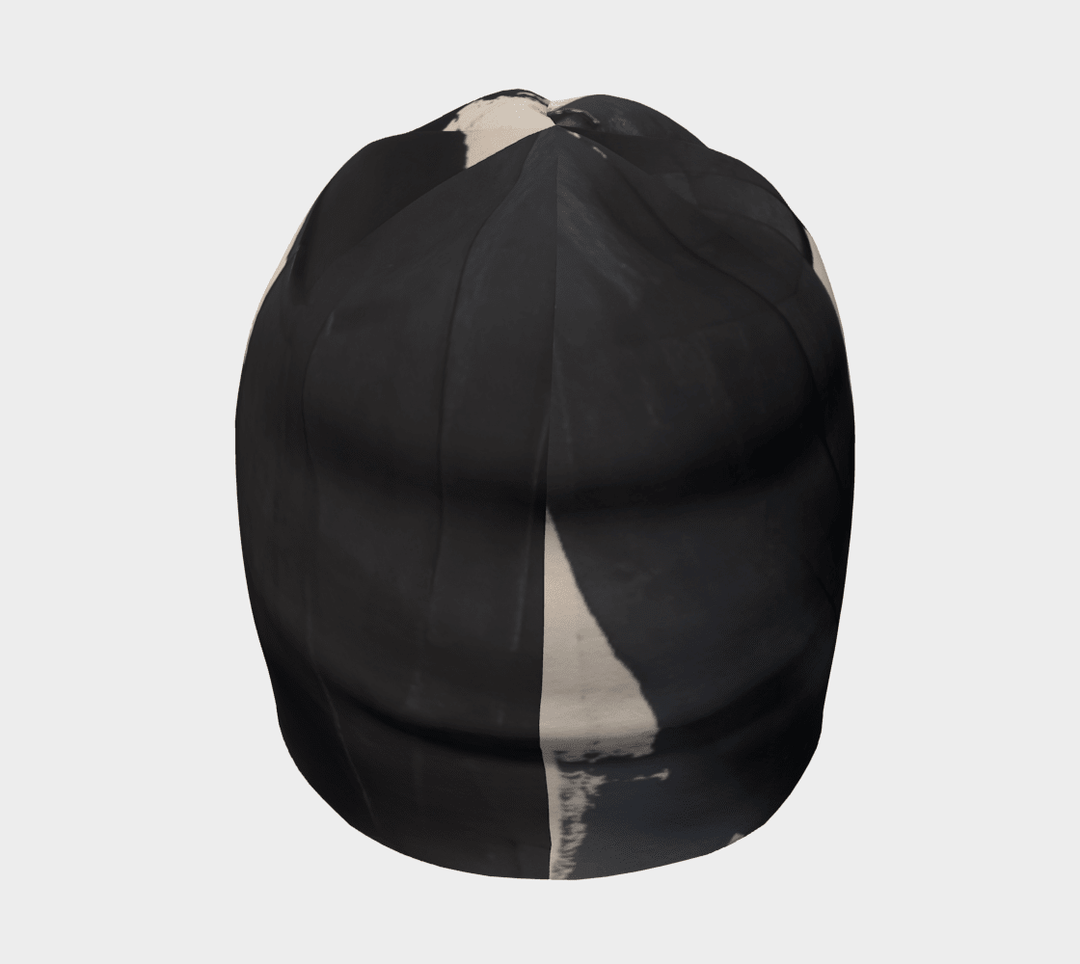 Black and cream abstract art pattern on a black beanie, viewed from the back.