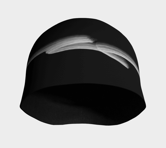 Black beanie with a white abstract brushstroke design shown from the bottom.