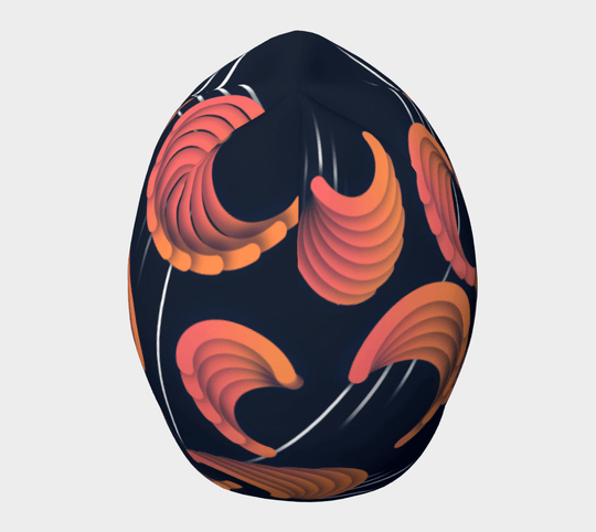3/4 view of a navy blue beanie with abstract orange and pink swirl patterns and thin white lines.