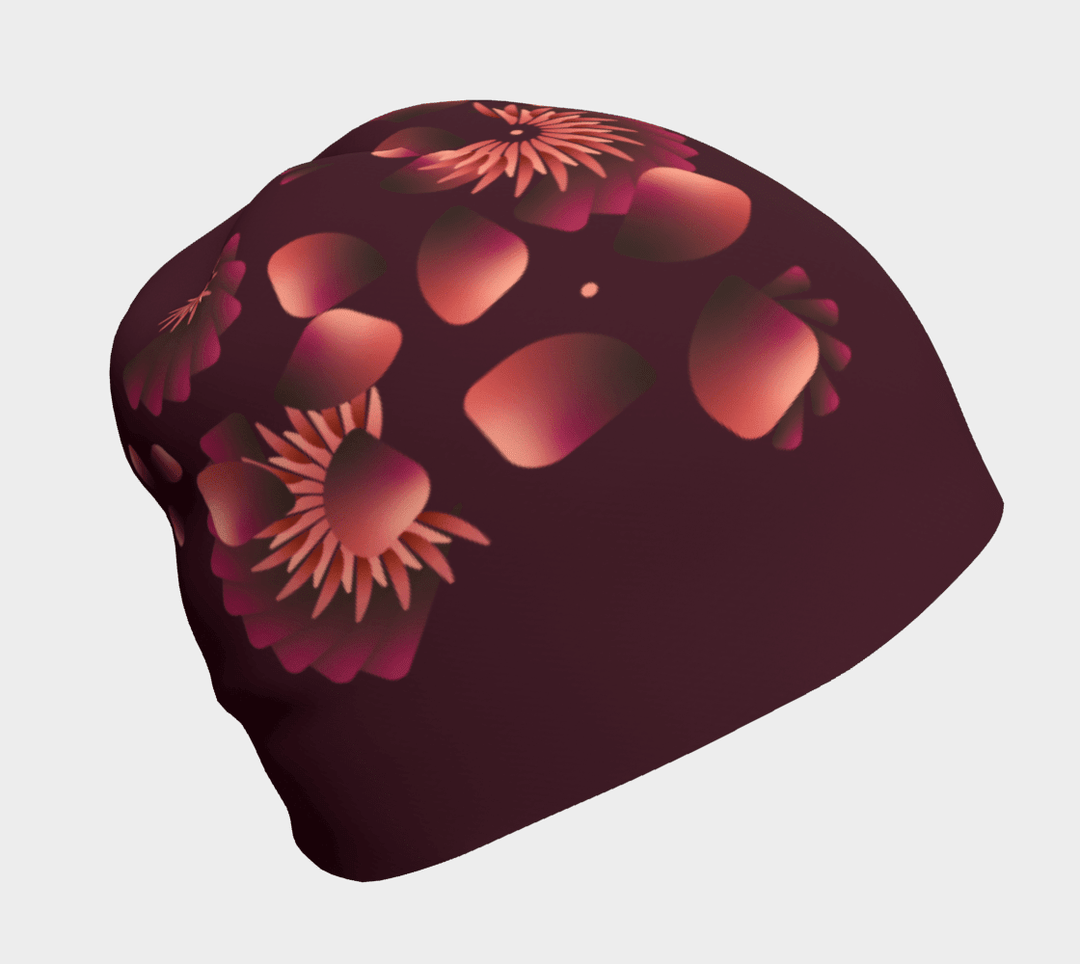 Une tuque marine avec un motif floral dégradé dans des tons de rose et d'orange.