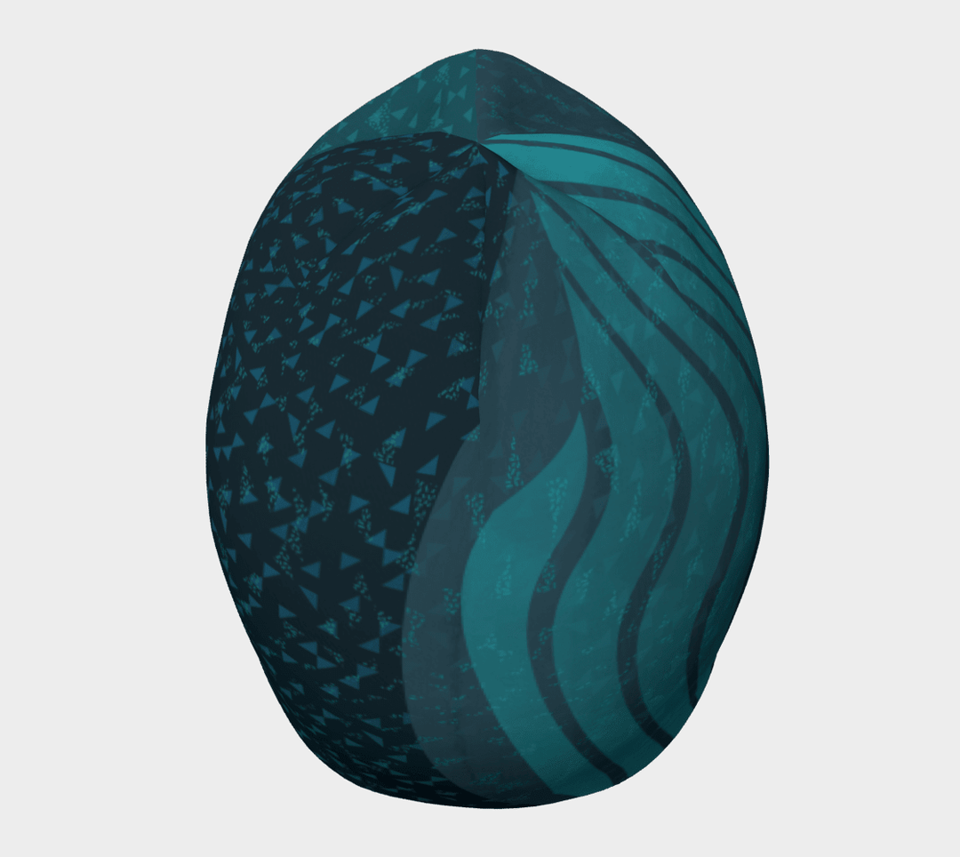 Top-down view of the Teal Flakes Beanie, revealing the abstract design with teal triangles and wavy lines.