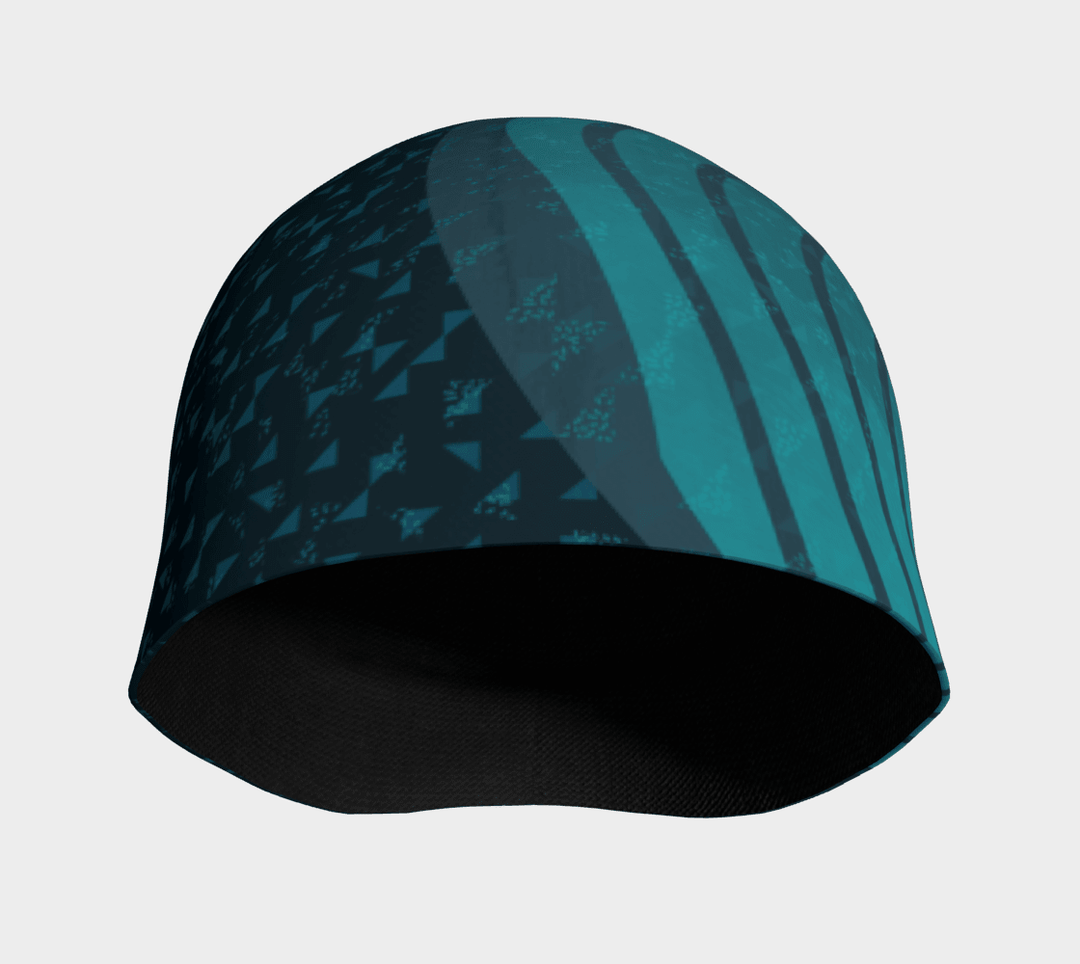 Interior view of the Teal Flakes Beanie, showing the dark bamboo lining and the &