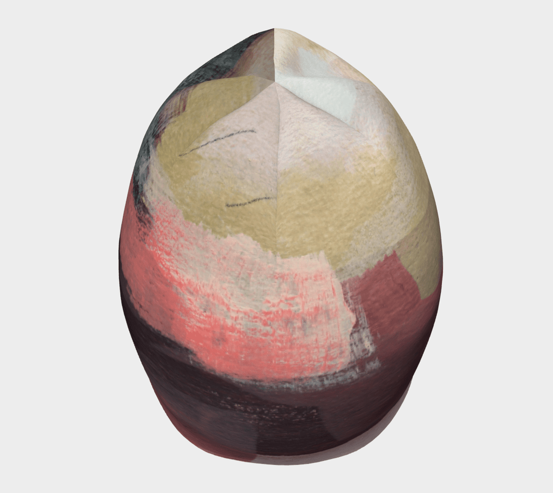 Top view of The Space Between Beanie, displaying a complex abstract design radiating from the crown.