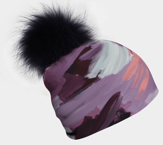 Tulips Beanie With Black Pompom showing abstract pastel art and a fluffy black pompom.