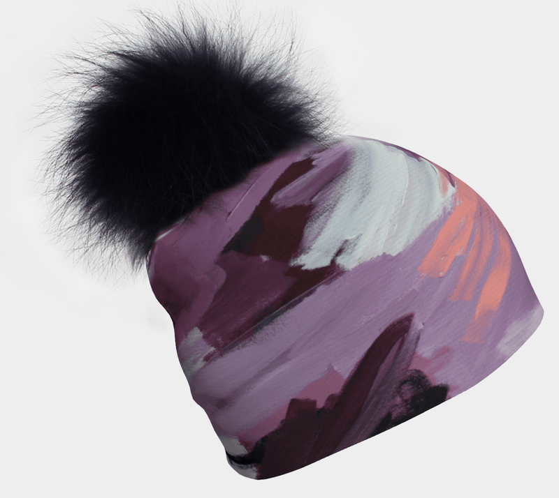 Tulips Beanie With Black Pompom showing abstract pastel art and a fluffy black pompom.
