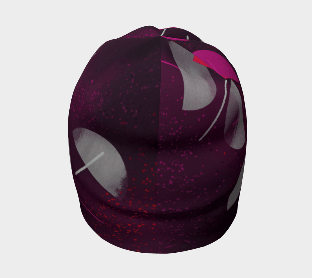 A full view of the Umbrella Magenta Beanie from the front, displaying the intricate artistic pattern.