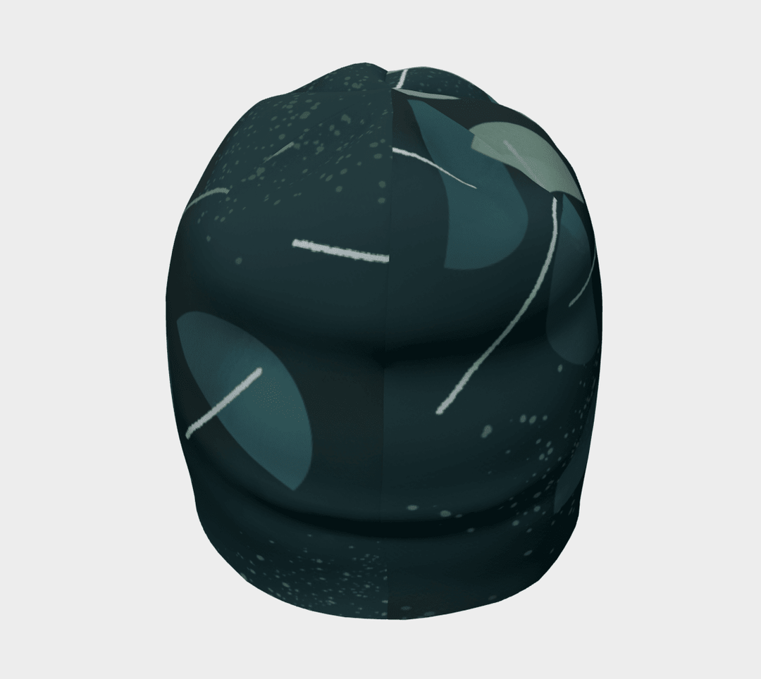 Side view of the dark teal abstract pattern beanie, highlighting the rounded crown and design.