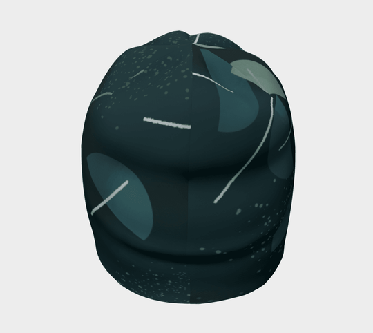 Side view of the dark teal abstract pattern beanie, highlighting the rounded crown and design.