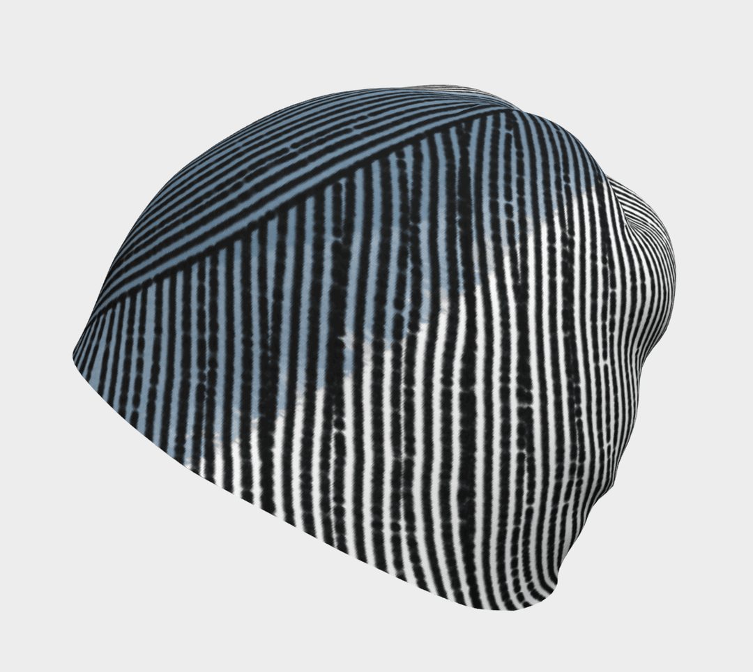 Unisex Abstract Lines Beanie with black, white, and blue abstract stripe pattern shown from the side.