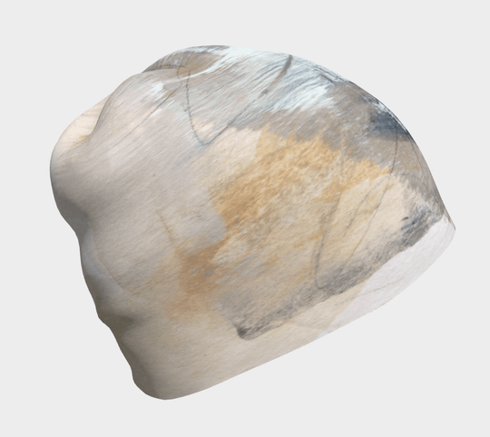 A close-up of the Unisex Sand Beanie, showcasing abstract brushstroke art in neutral tones.