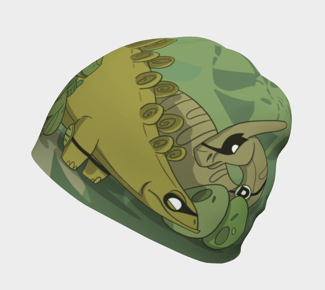 Side view of the green dinosaur beanie with a Stegosaurus and Pterodactyl design.