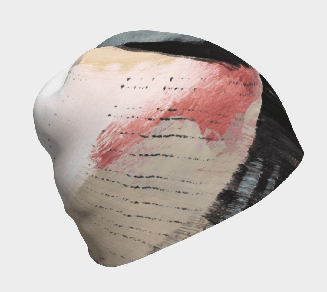 Close-up of the Vie en Rose Beanie, showcasing its abstract painted design in pink, black, and beige.