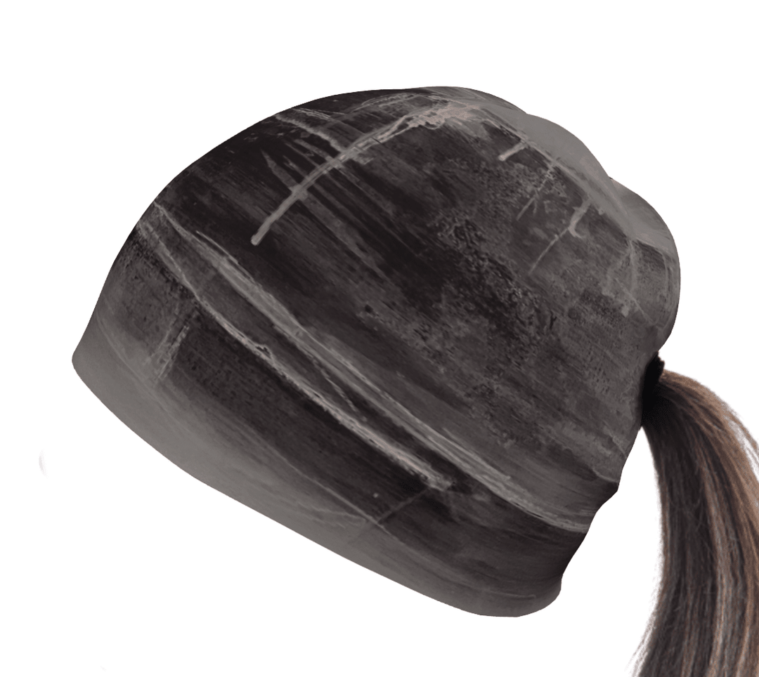 Black Wall beanie with abstract white brushstrokes, styled for a ponytail.