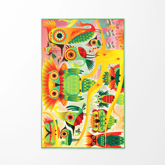 The vibrant, colorful side of the Wall of Birds towel shown flat, featuring a dense pattern of stylized birds and abstract shapes.