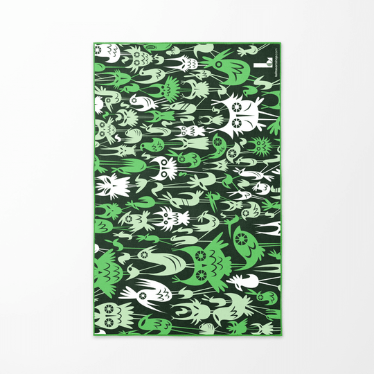 The dark green reverse side of the Wall of Birds towel shown flat, with a repeating pattern of white and light green stylized bird figures.