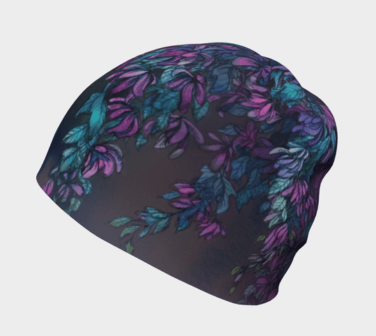 A dark Wisteria beanie with a purple and teal floral pattern shown from the side.